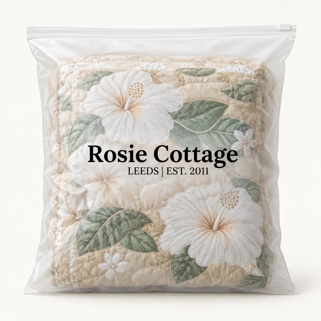 White Hibiscus quilt packed in a Rosie Cottage branded bag
